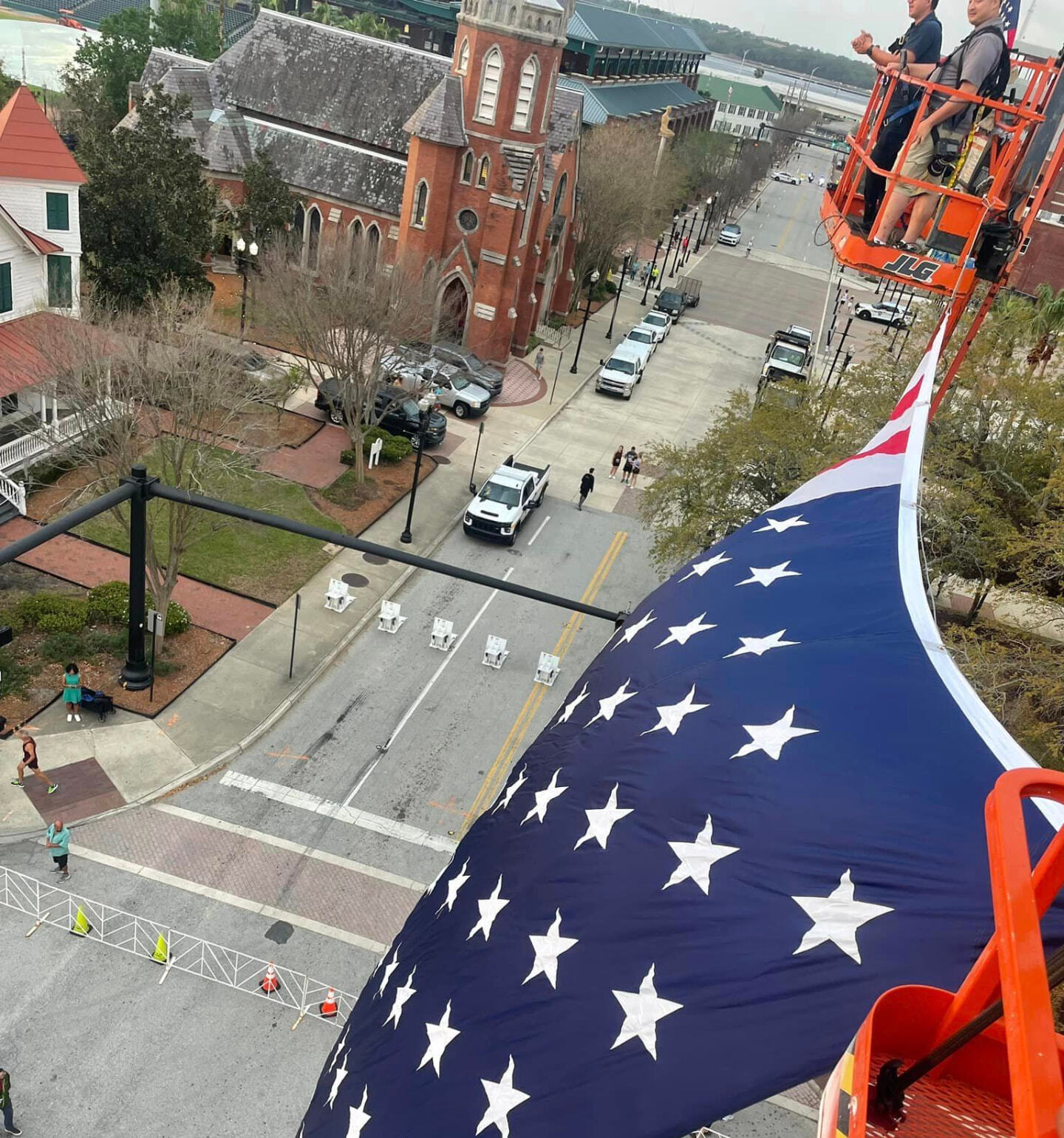 Kept crew in a lift hanging a giant American flag over a downtown Jacksonville street